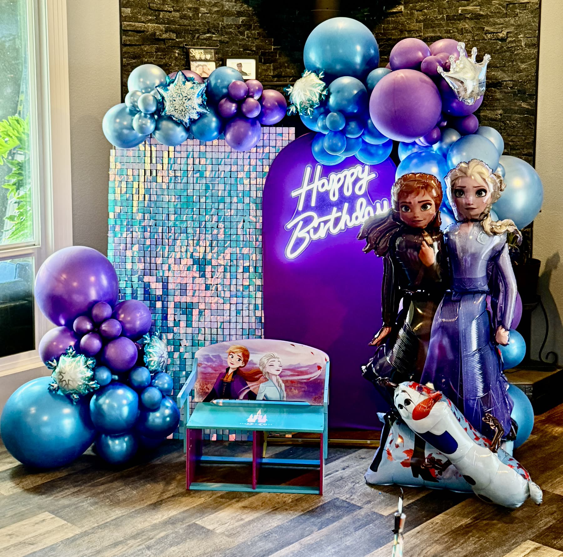 Frozen themed balloon backdrop with shimmer wall and character balloons